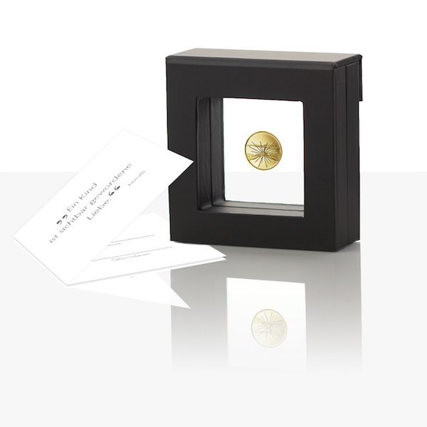 birth medal gold with packaging and card